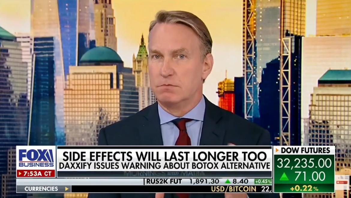 Dr. Douglas Steinbrech discussing male plastic surgery trends on Fox Business, emphasizing aesthetic treatments for men in New York City, with a backdrop of Manhattan skyscrapers.